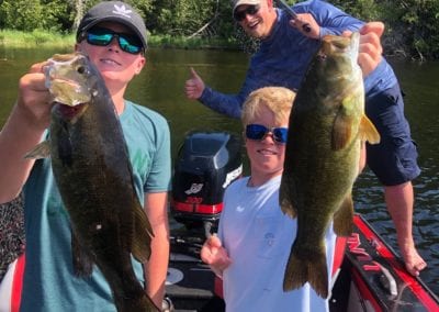 Family fishing bass in Canada