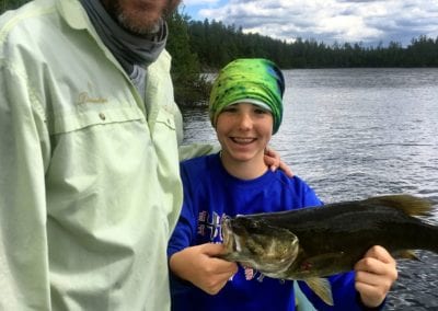 Father and daughter fishing trip with large bass