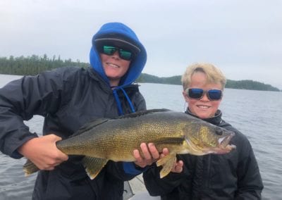 Young fishermen with giant walleye caught on Lower Manitou Lake in Ontario