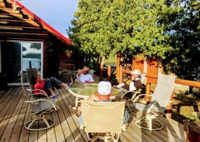 Anglers relaxing on main lodge deck after busy day fishing
