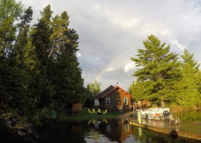 Rainbow in sky over resort main lodge