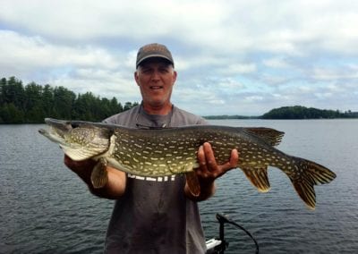 Angler with pike caught at Manitou Weather Station