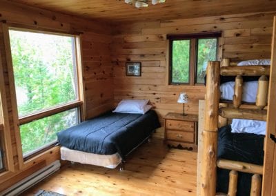 Bedroom at Point guest cabin at Manitou Weather Station with lake view