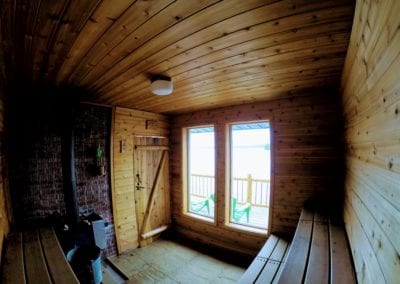 Sauna from the inside overlooking deck and Lower Manitou Lake
