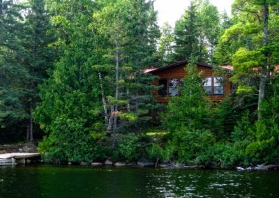 Looking at Tipperary guest cabin from lake Manitou, with boat dock