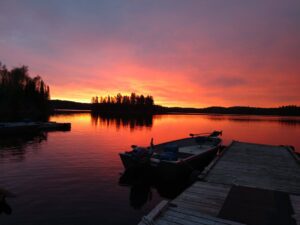 Sunset at Barker Bay at Manitou Weather Station with fishing boats